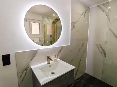a bathroom with a sink and a mirror at The Crown Panorama in Jajce