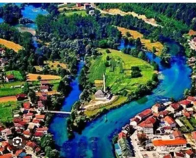 an aerial view of a river with houses at Insula in Otoka