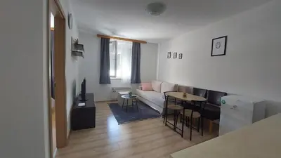 a living room with a couch and a table at Apartman Mario in Tomislavgrad
