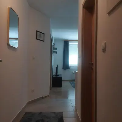 a hallway with a room with a mirror and a door at Apartman Mario in Tomislavgrad