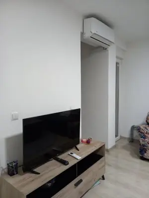 a living room with a large flat screen tv at Stan Živinice bb in Živinice