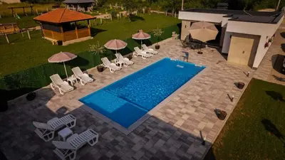 an overhead view of a swimming pool with chairs and umbrellas at Villa Ena in Praščijak