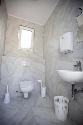 a bathroom with a sink and a toilet at Villa Ena in Praščijak