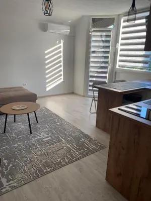 a living room with a couch and a table at Stay for 2 in Jajce