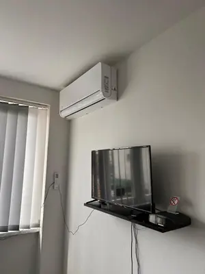 a flat screen tv on a wall in a room at Apartman EM Bugojno in Bugojno