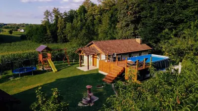 an aerial view of a small house with a playground at Kuca za odmor Lovric