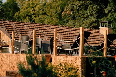 a group of chairs sitting on top of a roof at Kuca za odmor Lovric
