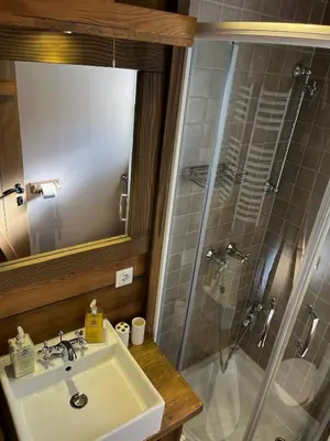 a bathroom with a sink and a shower at Runolist Kupres in Kupres