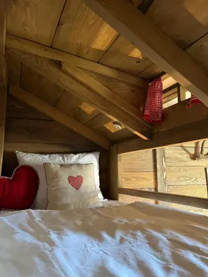 a bed with two pillows on it in a room at Runolist Kupres in Kupres