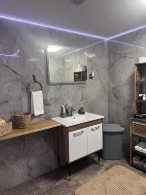 a bathroom with a sink and a mirror at Apartman Booem in Bihać