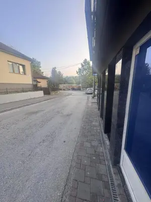 an empty street in front of a building at Apartman Booem in Bihać