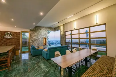 a living room with a couch and a table at Vila Natalijina Ramonda in Banja Luka