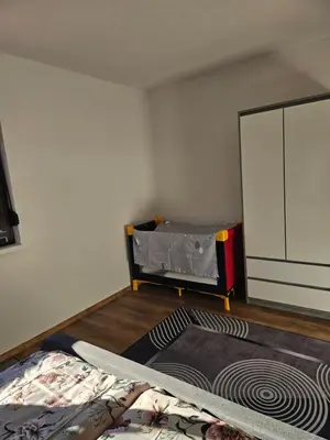 a room with a bed and a mirror in it at Apartman Una Paradies in Bihać