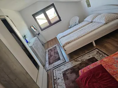 an overhead view of a bedroom with a bed and a window at Apartman Una Paradies in Bihać