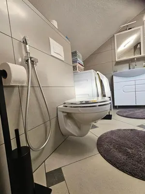 a bathroom with a toilet and a sink at Apartman Una Paradies in Bihać