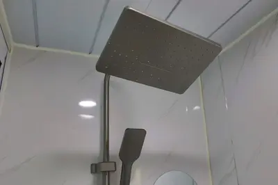 a lamp in a room with a microphone at Tiny House Ljiljan in Bihać