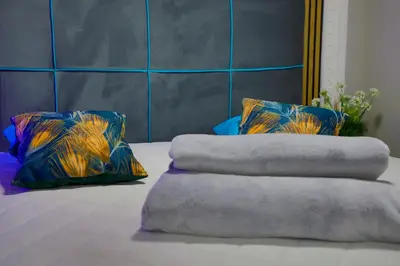 two pillows sitting on top of a bed at Tiny House Ljiljan in Bihać
