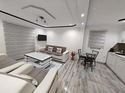 a living room with a couch and a table at Apartman Nermin 2 in Travnik