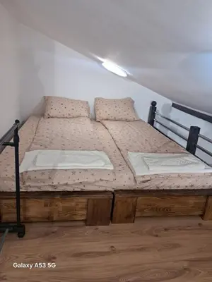 a bedroom with a bed in a room with at Apartman hukanovic in Bosanska Krupa