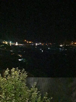 a view of a city at night with lights at Apartman hukanovic in Bosanska Krupa