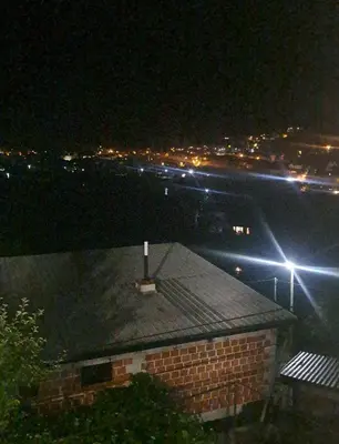 a roof of a building at night with lights at Apartman hukanovic in Bosanska Krupa