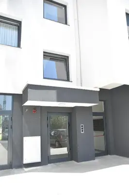 a building with a door in front of it at Apartman Sweet in Prijedor