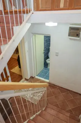 a staircase in a house with a mirror at Vikendica Sara in Šipovo