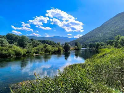 a river in the mountains with clouds in the sky at Vikendica Sara in Šipovo