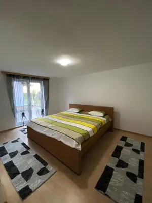 a bedroom with a bed in a room with a window at Anes House in Sokolac