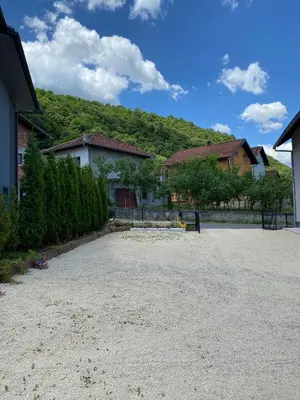 an empty driveway in front of a house at Anes House in Sokolac