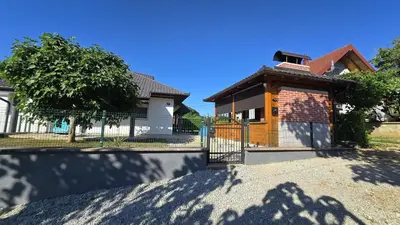 a house with a fence in front of it at Green Stay in Velika Kladuša