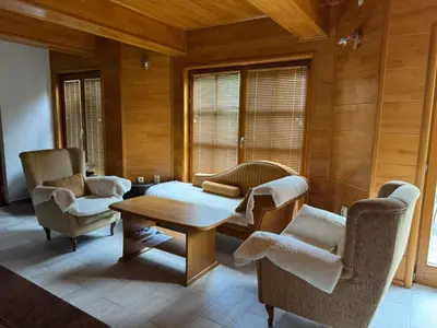 a living room with two chairs and a table at Villa Lavanda in Banja Luka