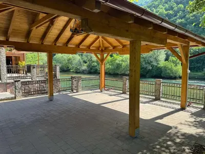 a wooden pavilion with a view of a river at Villa Lavanda in Banja Luka