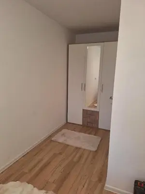 an empty room with a mirror and a wooden floor at Bugojno centar in Bugojno