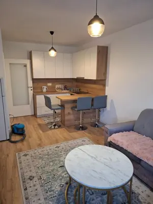 a living room with a couch and a table at Bugojno centar in Bugojno