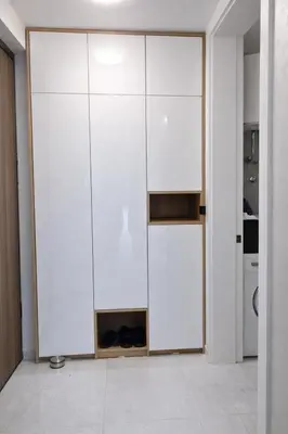 a room with a white closet with shoes in it at Lana Apartmani Autor in Tuzla