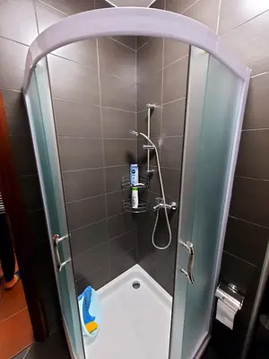 a shower with a glass door in a bathroom at AnyBL01 in Banja Luka