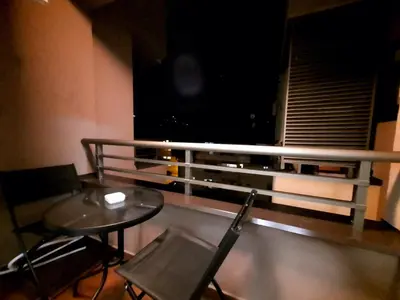 a balcony with a table and chairs and a window at AnyBL01 in Banja Luka