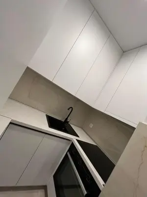 a kitchen with a white ceiling and a sink at Lux Apartman Kotor Varoš in Donja Varoš