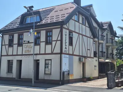 a building on the corner of a street at Villa Una in Bihać