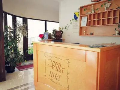 a counter with a sign on it in a room at Villa Una in Bihać