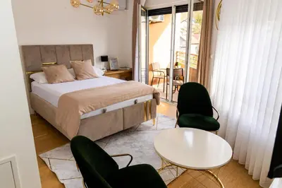 a bedroom with a bed and a table and chairs at Urban Studio I