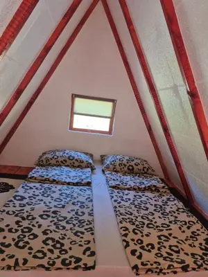 a room with two beds in a tent at Adna 's Home in Orašac