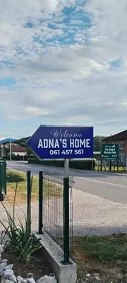 a sign on a fence on the side of a road at Adna 's Home in Orašac