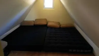 a couch sitting in the middle of a stairs at Vikendica Brusnica