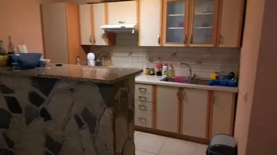 a kitchen with a sink and a counter top at Vikendica Brusnica
