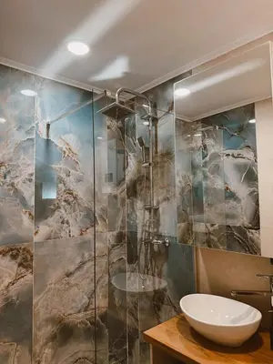 a bathroom with a sink and a shower at RajRaj apartmani Gradiska in Bosanska Gradiška