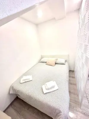 a small room with a bed with two towels on it at Apartment M&S in Bosanski Novi