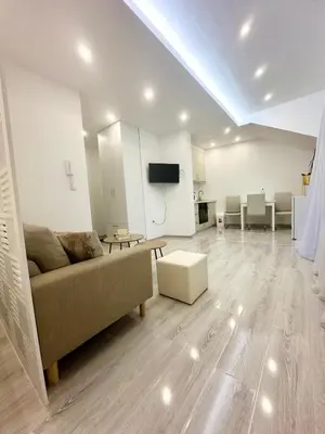a living room with a couch and a table at Apartment M&S in Bosanski Novi