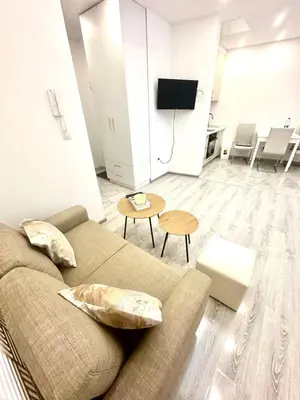 a living room with a couch and a table at Apartment M&S in Bosanski Novi